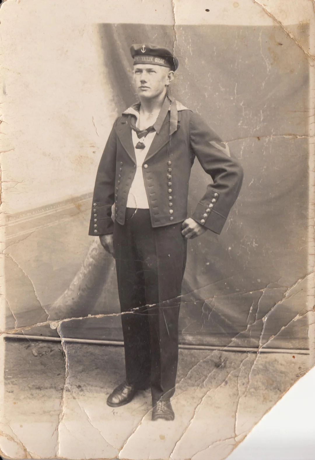 Old damaged photo with torn corners and missing paper edges